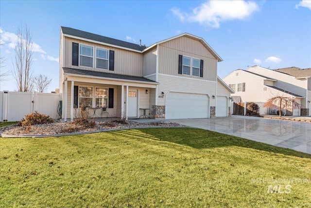 view of front of property with a garage and a front yard