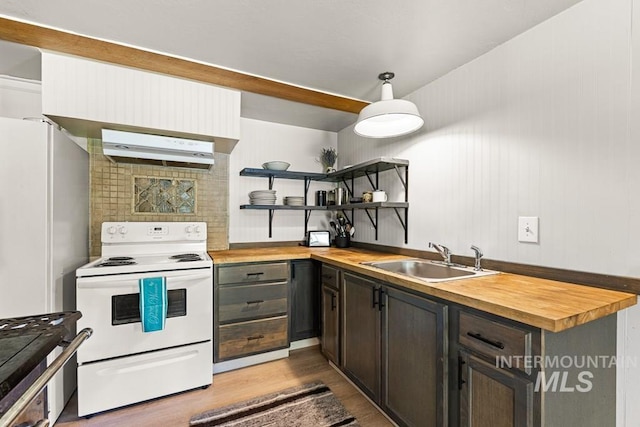 255 Seven U Ranch Rd, Lucile, ID 83542 - kitchen featuring wooden counters, range hood, white appliances, and a sink