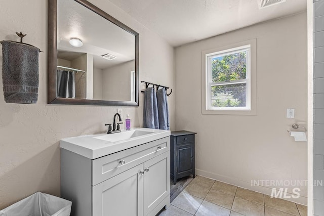 255 Seven U Ranch Rd, Lucile, ID 83542 - full bath featuring vanity, tile patterned flooring, and baseboards