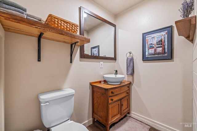 255 Seven U Ranch Rd, Lucile, ID 83542 - bathroom with vanity, baseboards, and toilet