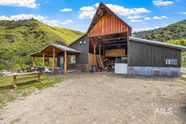 255 Seven U Ranch Rd, Lucile, ID 83542 - view of outbuilding featuring a mountain view and an exterior structure