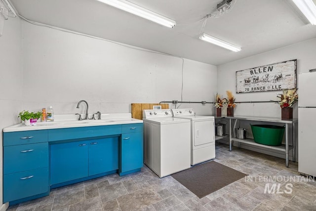 255 Seven U Ranch Rd, Lucile, ID 83542 - laundry room with washing machine and clothes dryer, cabinet space, and stone finish flooring