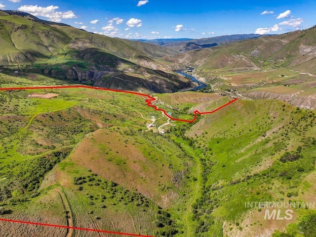 255 Seven U Ranch Rd, Lucile, ID 83542 - aerial overview of property's location featuring property parcel outlined and a mountainous background