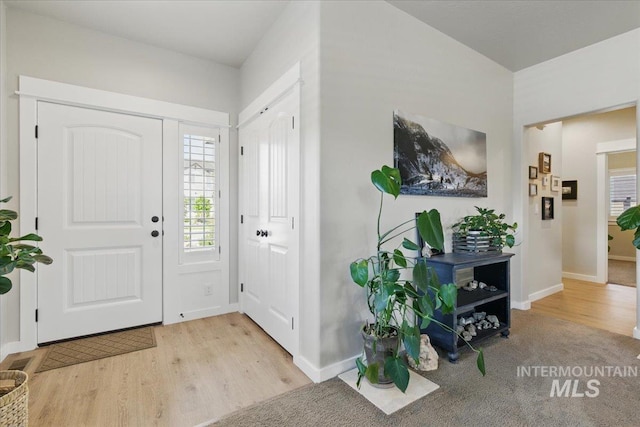 5707 W Elk Trail St Unit 630, Boise, ID 83714 - foyer entrance with wood finished floors and baseboards