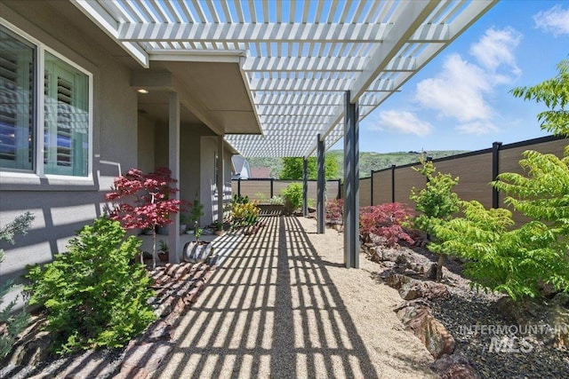 5707 W Elk Trail St Unit 630, Boise, ID 83714 - fenced backyard featuring a pergola and a patio area