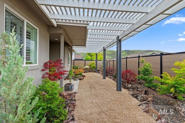 5707 W Elk Trail St Unit 630, Boise, ID 83714 - fenced backyard featuring a pergola and a patio