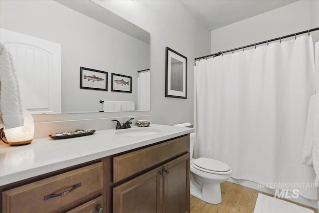 5707 W Elk Trail St Unit 630, Boise, ID 83714 - full bath featuring vanity, wood finished floors, and toilet