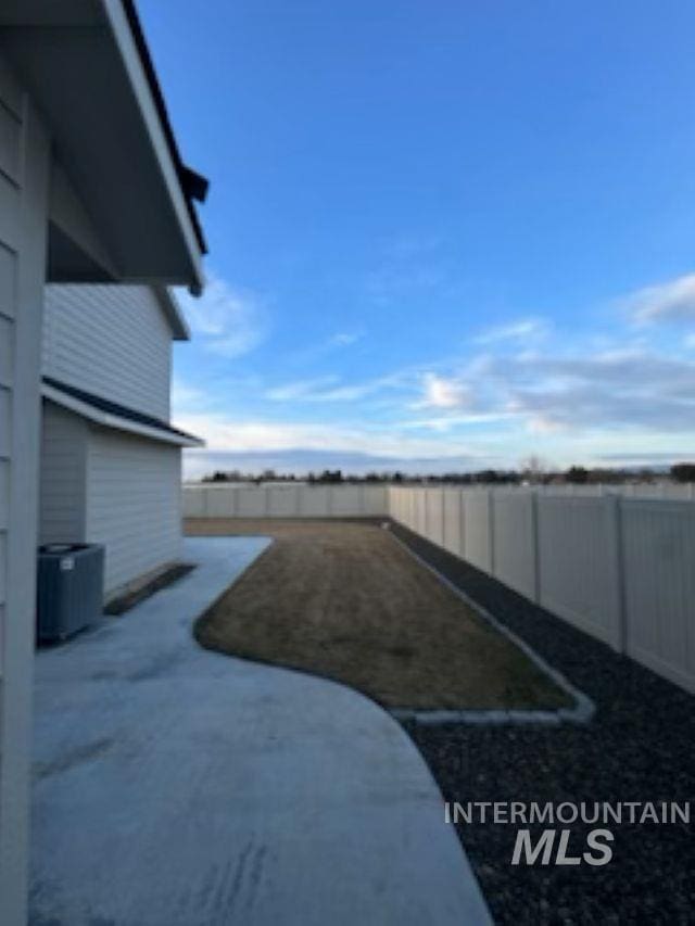 view of yard with a fenced backyard and a patio area