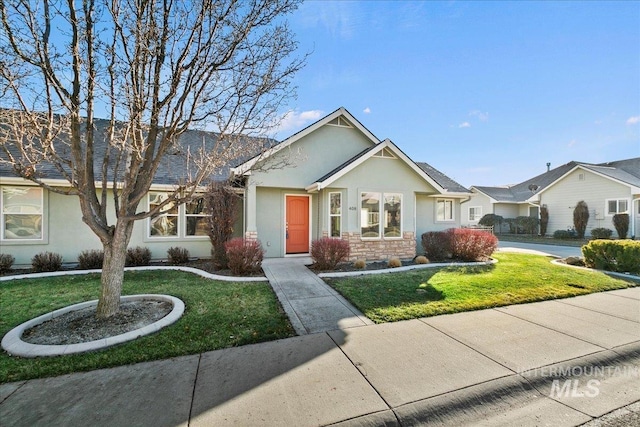 ranch-style home with a front yard