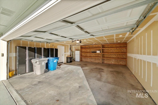 garage featuring white refrigerator