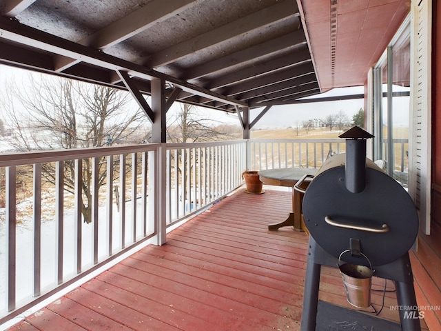 view of snow covered deck