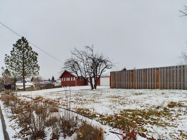 view of yard layered in snow