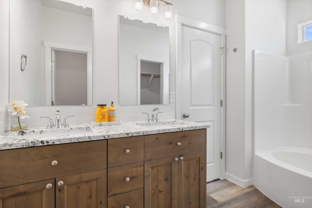 205 W 13th Ave, Jerome, ID 83338 - full bathroom with double vanity and wood finished floors