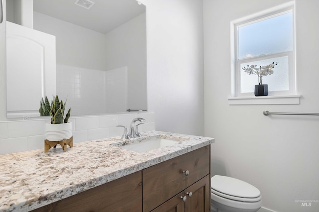 205 W 13th Ave, Jerome, ID 83338 - bathroom featuring vanity and toilet