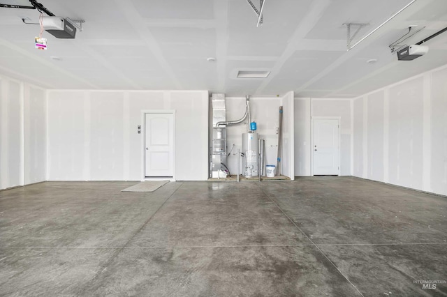 205 W 13th Ave, Jerome, ID 83338 - garage featuring water heater, a garage door opener, and heating unit