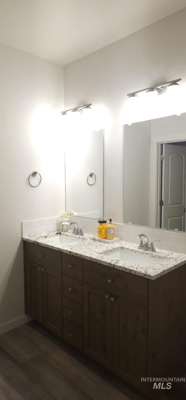 205 W 13th Ave, Jerome, ID 83338 - full bath featuring double vanity, wood finished floors, and baseboards