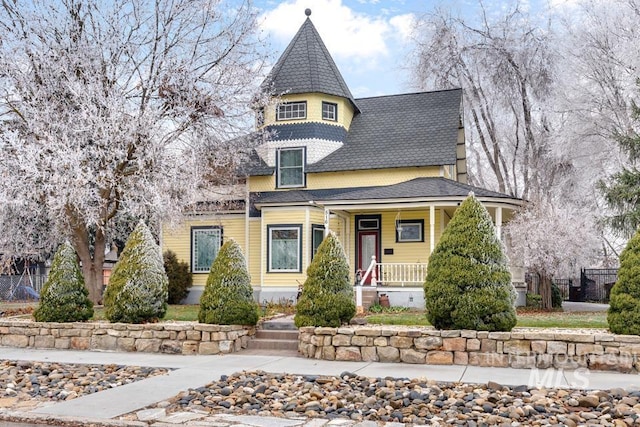 victorian-style house featuring covered porch