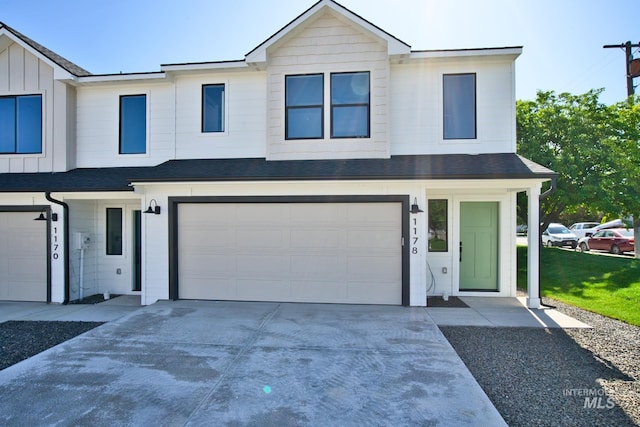 1178 S Barberry Pl, Nampa, ID 83686 - view of front of property featuring a garage, concrete driveway, board and batten siding, and a shingled roof
