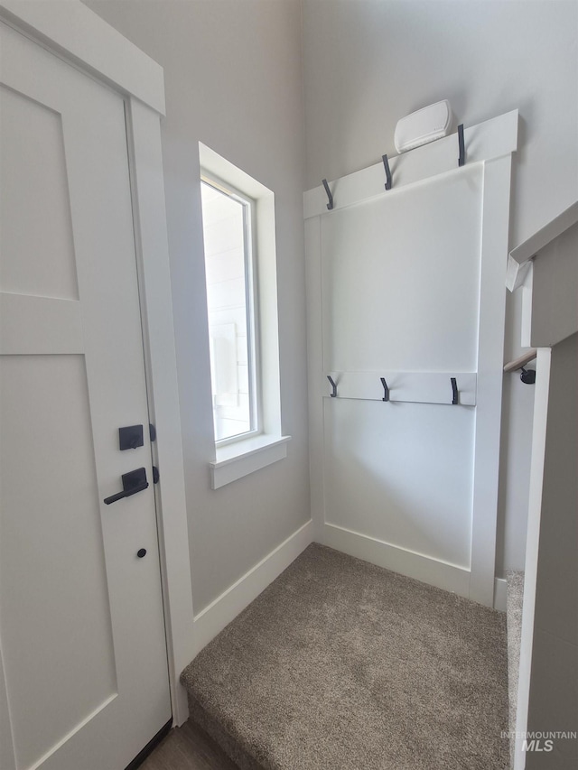 1178 S Barberry Pl, Nampa, ID 83686 - mudroom featuring dark carpet and baseboards