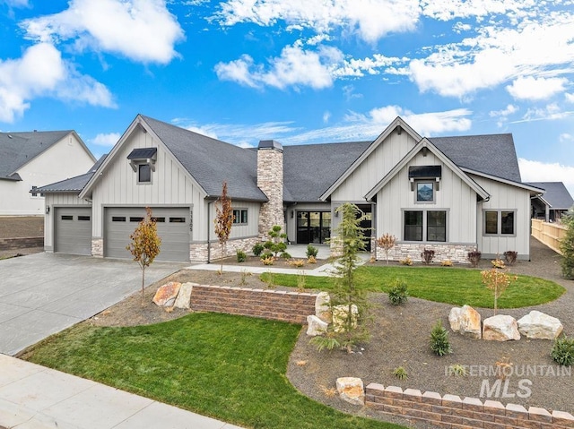 modern farmhouse with a garage and a front yard