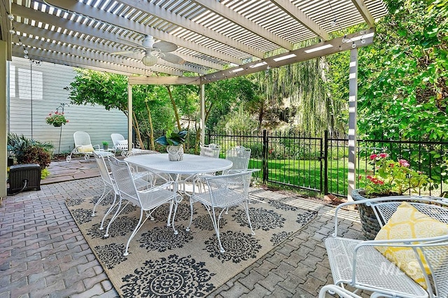 view of patio / terrace with fence, outdoor dining area, and a pergola