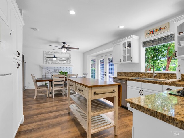 248 N Palmetto Dr, Eagle, ID 83616 - kitchen featuring stainless steel dishwasher, white cabinetry, plenty of natural light, and recessed lighting