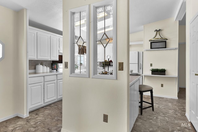 interior space with baseboards