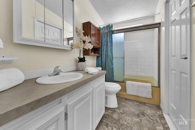 bathroom with enclosed tub / shower combo, stone finish floor, toilet, vanity, and a textured ceiling