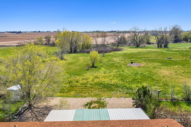 view of yard with a rural view