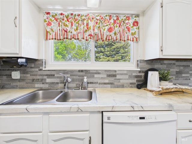 1929 S 2350 E, Malta, ID 83342 - kitchen featuring white dishwasher, a sink, light countertops, and white cabinets