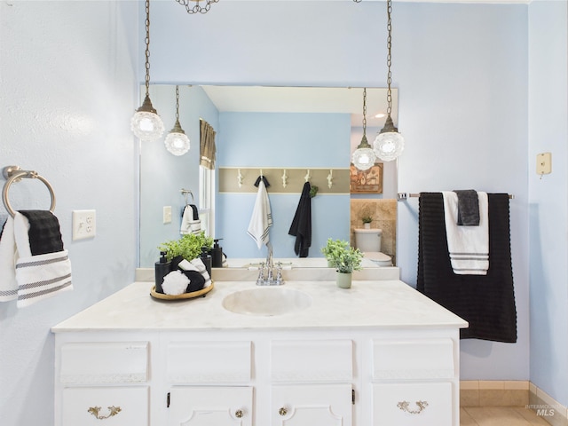 1929 S 2350 E, Malta, ID 83342 - bathroom featuring vanity, tile patterned flooring, toilet, and baseboards
