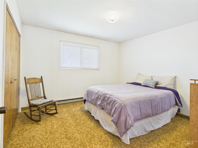 1929 S 2350 E, Malta, ID 83342 - carpeted bedroom with a baseboard heating unit and a closet