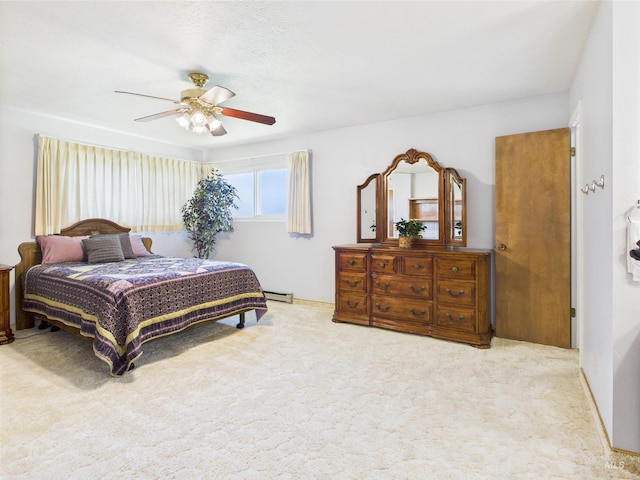 1929 S 2350 E, Malta, ID 83342 - bedroom with carpet flooring, ceiling fan, and a baseboard heating unit