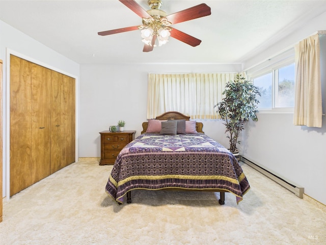 1929 S 2350 E, Malta, ID 83342 - carpeted bedroom with a baseboard radiator, a ceiling fan, and a closet
