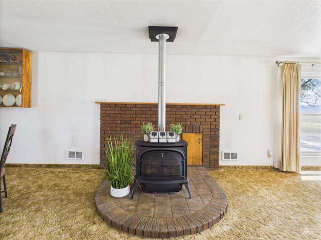 1929 S 2350 E, Malta, ID 83342 - detailed view of carpet flooring and a wood stove