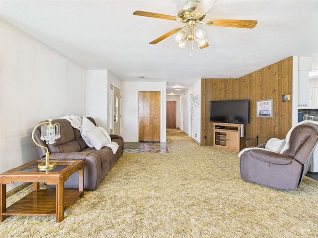 1929 S 2350 E, Malta, ID 83342 - carpeted living room featuring a ceiling fan and wooden walls