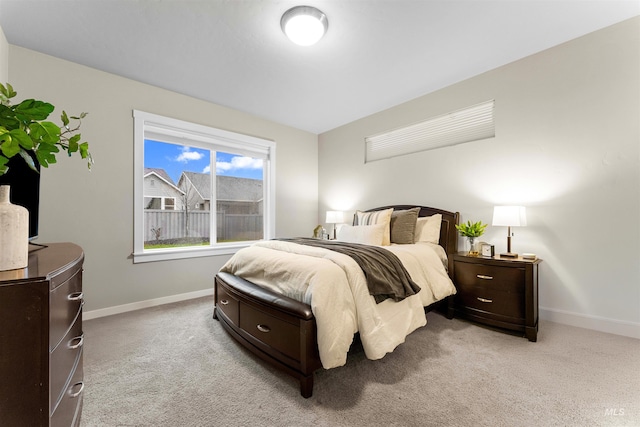 bedroom with light colored carpet