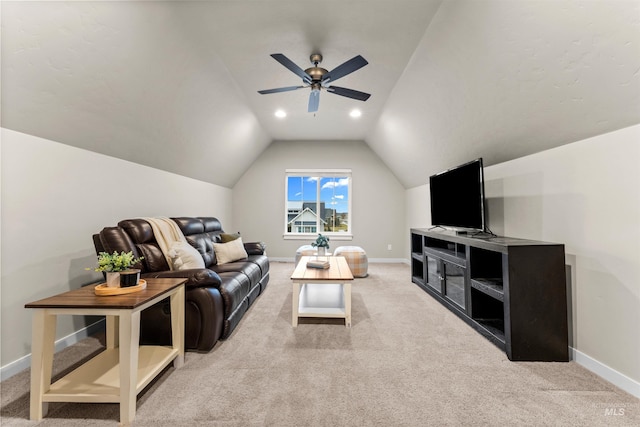 living room featuring ceiling fan, lofted ceiling, and light carpet