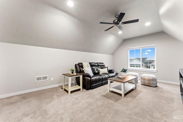 living room with light colored carpet, vaulted ceiling, and ceiling fan