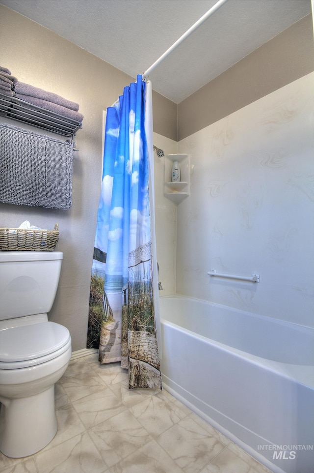 full bathroom with shower / tub combo, marble finish floor, and toilet