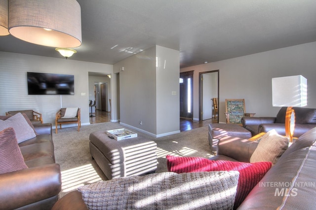 living area with carpet and baseboards