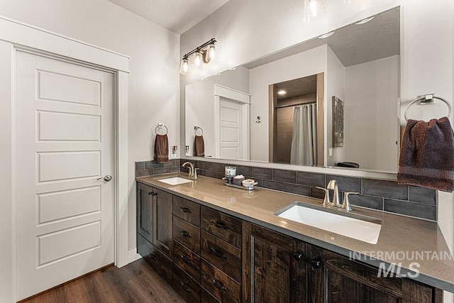 59 S Ravine Way, Nampa, ID 83687 - full bath with backsplash, double vanity, wood finished floors, and a shower with curtain