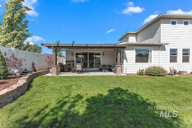 59 S Ravine Way, Nampa, ID 83687 - back of property with a patio area and outdoor lounge area