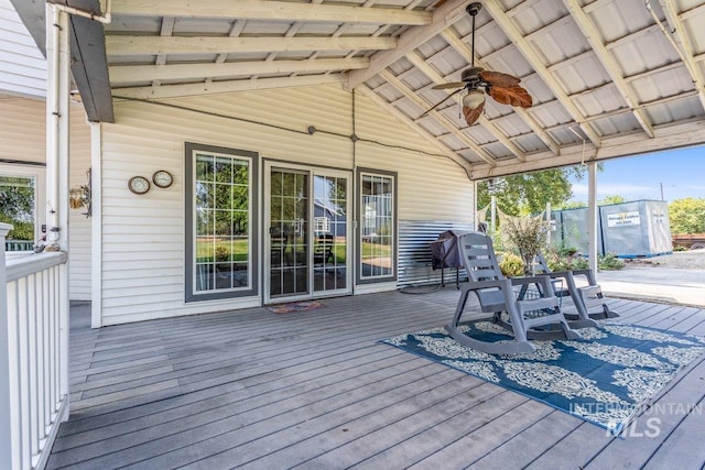 deck featuring area for grilling and ceiling fan