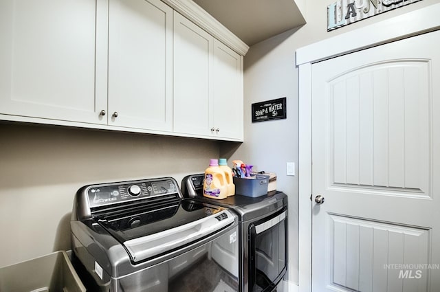 1234 W Sagwon Dr, Kuna, ID 83634 - laundry room with washing machine and clothes dryer and cabinet space