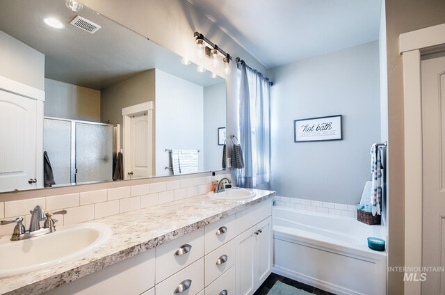 1234 W Sagwon Dr, Kuna, ID 83634 - bathroom featuring double vanity, a stall shower, and a garden tub