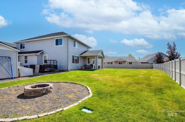 1234 W Sagwon Dr, Kuna, ID 83634 - back of property featuring a fire pit and a patio