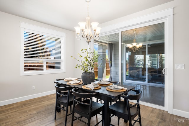 10685 W Evelia St, Boise, ID 83709 - dining area with a chandelier and wood finished floors