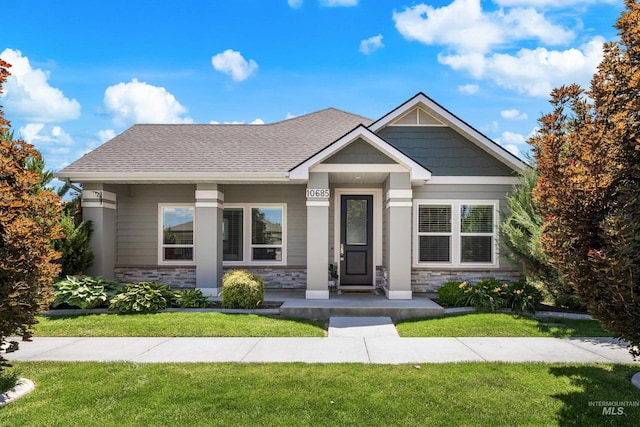 10685 W Evelia St, Boise, ID 83709 - view of front of home with a front lawn and stone siding