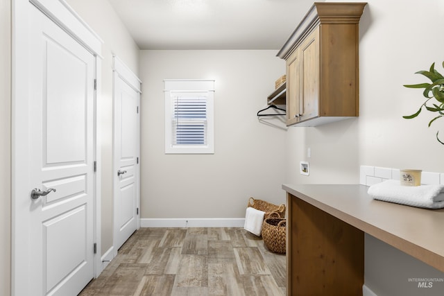10685 W Evelia St, Boise, ID 83709 - laundry room with light wood finished floors, hookup for a washing machine, and cabinet space